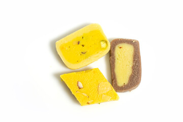 Various Indian sweets during a festive event on a white surface. Top view