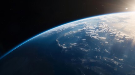 Stunning view of Earth from space, showcasing the blue planet with clouds and sunlight.