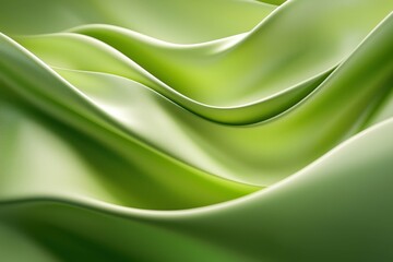 Obraz premium Flowing green fabric showcasing soft curves and smooth texture.