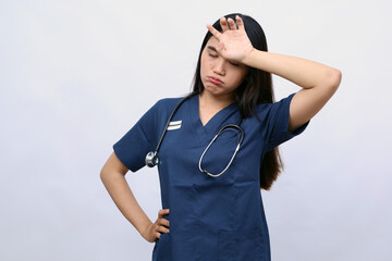 Medicine, healthcare and pandemic concept sad young female doctor or nurse wearing face protective for protection from virus disease isolated on white background