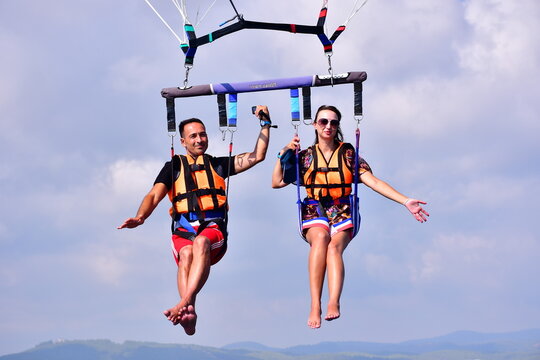 Parasaling over the sea . High quality photo