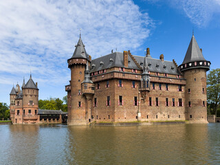 De Haar Castle exterior, Utrecht, Netherlands. The famous and biggest medieval castle in the Netherlands, tourist landmark, view from lake at sunny summer day