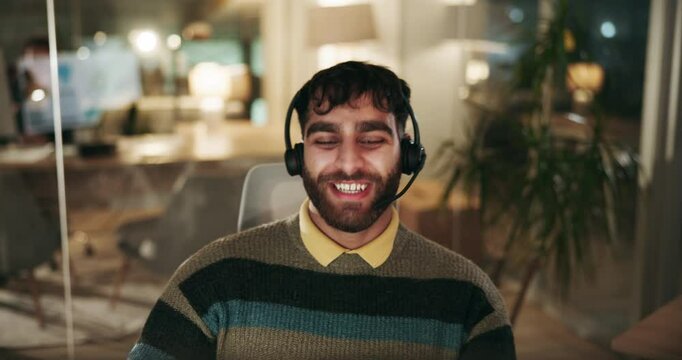 Call center, winning and consultant in office at night with international customer service for crm. Happy, headset and technical support specialist with celebration for bonus with global client sale.