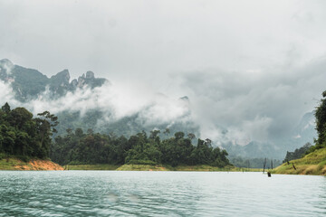 lake and mountain landscapes with clouds in khao sok
