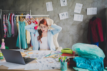 Photo of amazed fashion designer girl sit office feel impressed with failed sketch in workplace