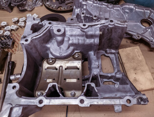 the upper oil pan section of a car engine