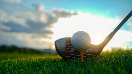 Golf clubs and balls on a green lawn in a beautiful golf course with morning sunshine.