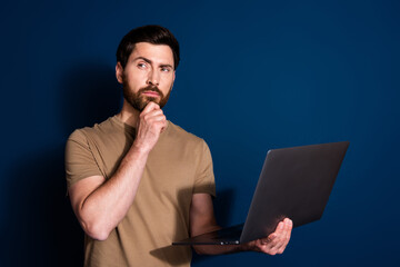 Photo of professional it specialist programmer brunet man with laptop minded looking copyspace...