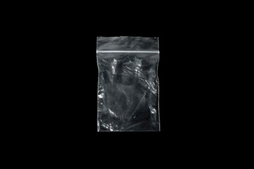 Transparent plastic bag isolated on black background.