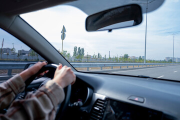 Girl driving a car. Beautiful girl in a car. Red-haired. Young driver. Confident girl driving a car. Girl on the phone. young woman in car. autumn travel.