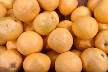 top view many orange ripe grapefruits. citrus fruits