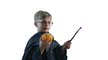 A wizard boy with a magic wand in a Halloween costume