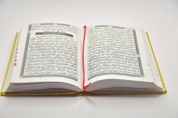 Obraz premium Close up of the Muslim holy book Koran on a white background