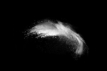 White powder explosion on black background.