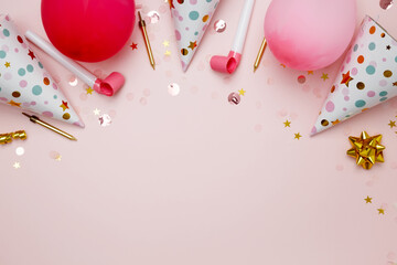 Birthday attributes colorful balloons, party hats and confetti. Concept of festive birthday...