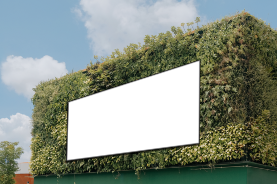 Mock up template: Long horizontal billboard out of home OOH advertising poster on side of building. Frame is inset on wall covered with plants. Lush background against blue sky. Transparent png file
