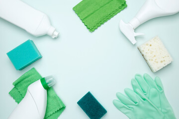 Cleaning supplies and tools, including bottles, gloves, sponges, and cloths. Concept of cleanliness and hygiene