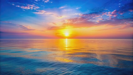 Fototapeta premium Morning sunrise over a blue sea with a pink sky, yellow sun glow, and golden reflection on the water , sunrise