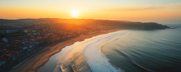 Aerial view of a coastal city at sunrise
