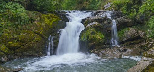 Fototapeta premium Waterfall on the Plazaola Greenway. Waterfall of Ixkier on the Plazaola Greenway, Navarre