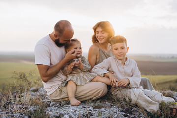 Happy Family Enjoying Quality Time Together Outdoors During Sunset