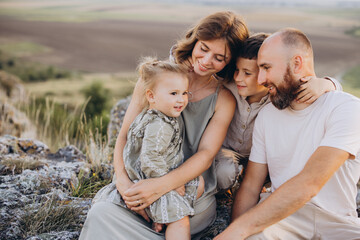 Happy Family Enjoying Time Outdoors on a Sunny Day in Nature