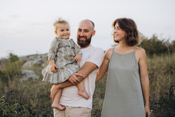 Happy Family Outdoors Enjoying Quality Time Together in a Beautiful Natural Setting