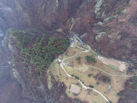 Monastery Stanisoara tails of the monastery, Olt River in the Olt Valley bridge beautiful gorge river in Romania, defile carved valley near Cozia national park
