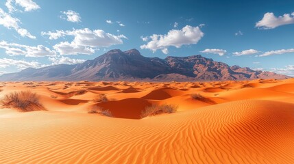 Naklejka premium Vast desert landscape with mountains and dramatic sky.