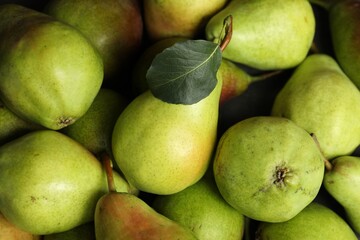 Many fresh ripe pears as background, top view