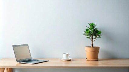 Fototapeta premium Minimalist workspace with a green potted plant creating a sense of natural tranquility, minimalist, workspace