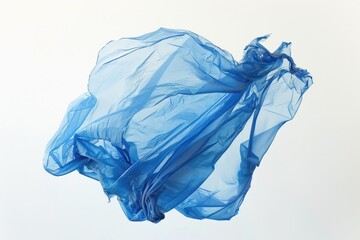 Fototapeta premium A cobalt blue plastic bag, its edges frayed and weathered