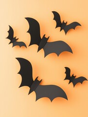 A group of black bats are hanging from a wall