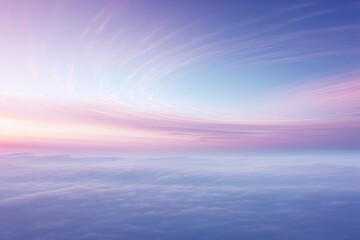 Naklejka premium A wispy cirrostratus cloud delicately tracing its path across the horizon, bathed in the soft hues of dawn.