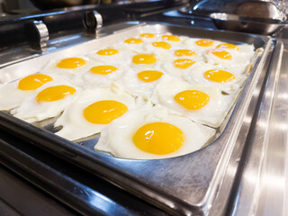Concept of food All-inclusive buffet-style in Turkey. A place with a lot of fried eggs, scrambled eggs. Horizontal orientation. Selective focus.