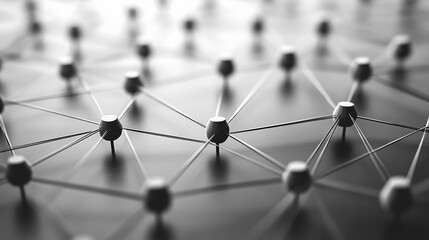 Abstract network of interconnected white pins on a grey surface, representing connectivity, communication, and relationships.