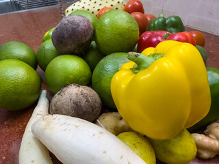 Fresh Sweet lemon, tomato and colorful bell pepper with plain background.