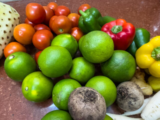 Fresh Sweet lemon, tomato and colorful bell pepper with plain background.