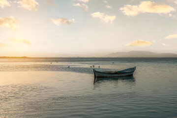 Naklejka premium Fishing boats in the Karina region near the Söke district of Aydın province Turkey are heated by sunlight at sunrise