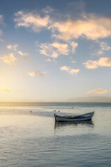 Naklejka premium Fishing boats in the Karina region near the Söke district of Aydın province Turkey are heated by sunlight at sunrise