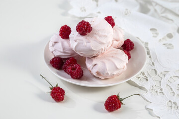 Marshmallow cookies with fresh raspberries for tea, selective focus