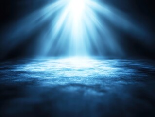 Obraz premium A serene blue ambiance created by soft light rays illuminating a calm surface, ideal for backgrounds and tranquil scenes.