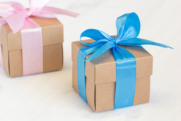 Brown gift box on white wood table background