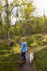 Family with kids and dog, hiking the Abisko National Park near Kiruna on a summer day