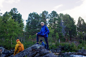Family with kids and dog, hiking the Abisko National Park near Kiruna on a summer day