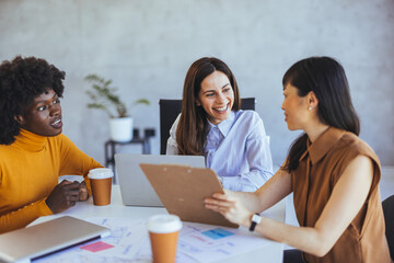 Diverse Group of Women in Office Meeting Collaborating