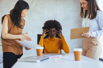 Stressed Employee in Business Meeting with Colleagues