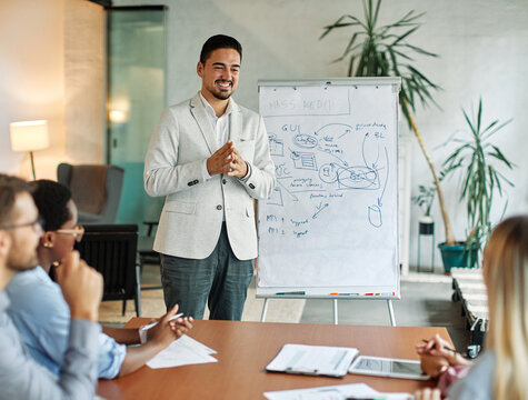 business meeting businessman man young office presentation whiteboard teamwork startup start up project group colleague student seminar businessperson