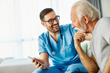 nurse doctor senior care tablet computer technology showing caregiver help assistence retirement...
