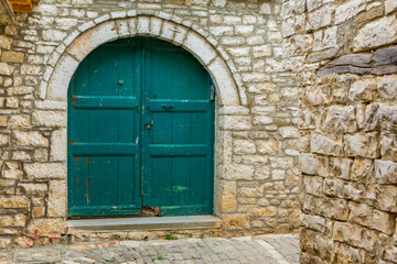 The famous old town of Berat in Albania. Picturesque street with houses from the Ottoman era. Beautiful landscape in central Albania.